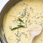 Gorgonzola Cream Sauce in bowl with rosemary garnish