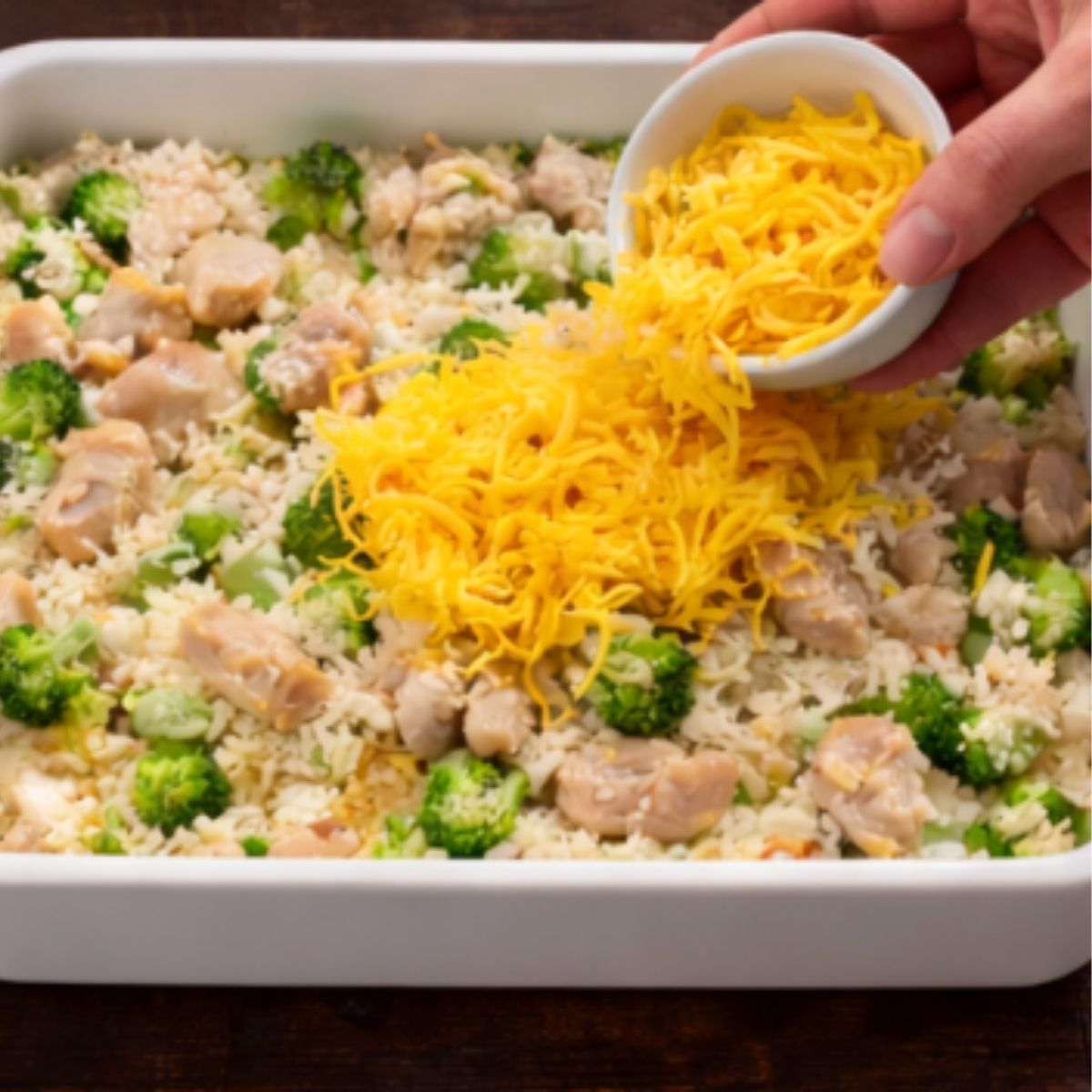 Old-fashioned chicken and rice casserole with broccoli topped with cheese