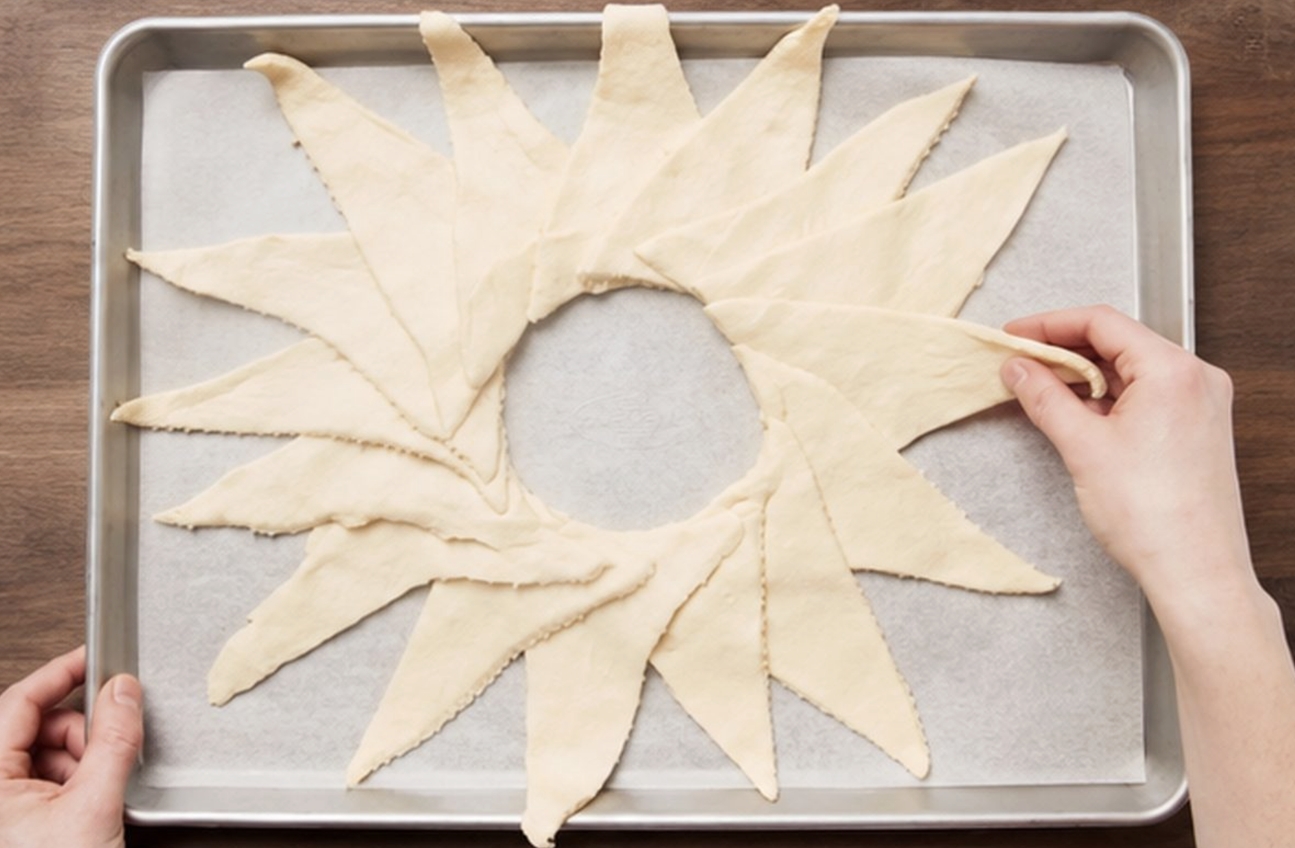 Crescent roll triangles arranged in a circle to make a taco ring