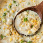 creamy chicken corn chowder with wooden spoon