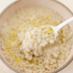 Italian Pastina Soup in bowl with a spoon. a thicker version.