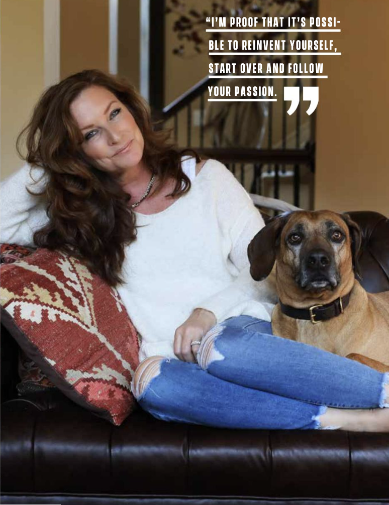 Lauren Lane in Johnson County Lifestyle Magazine. On a sofa with a Ridgeback.