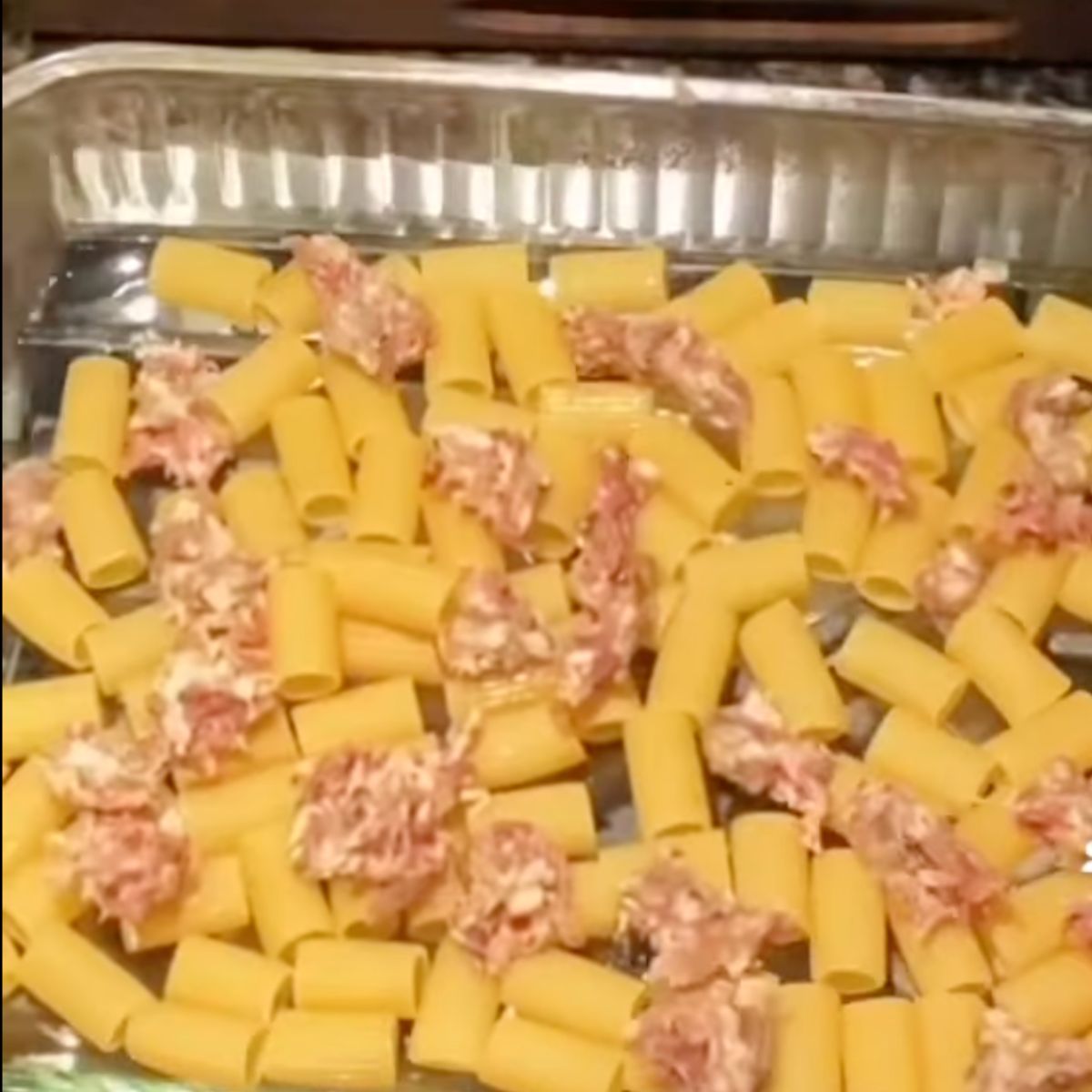 rigatoni and sausage in glass dish
