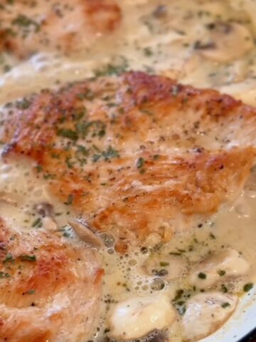 Boursin chicken with browned chicken cutlets in a creamy sauce.