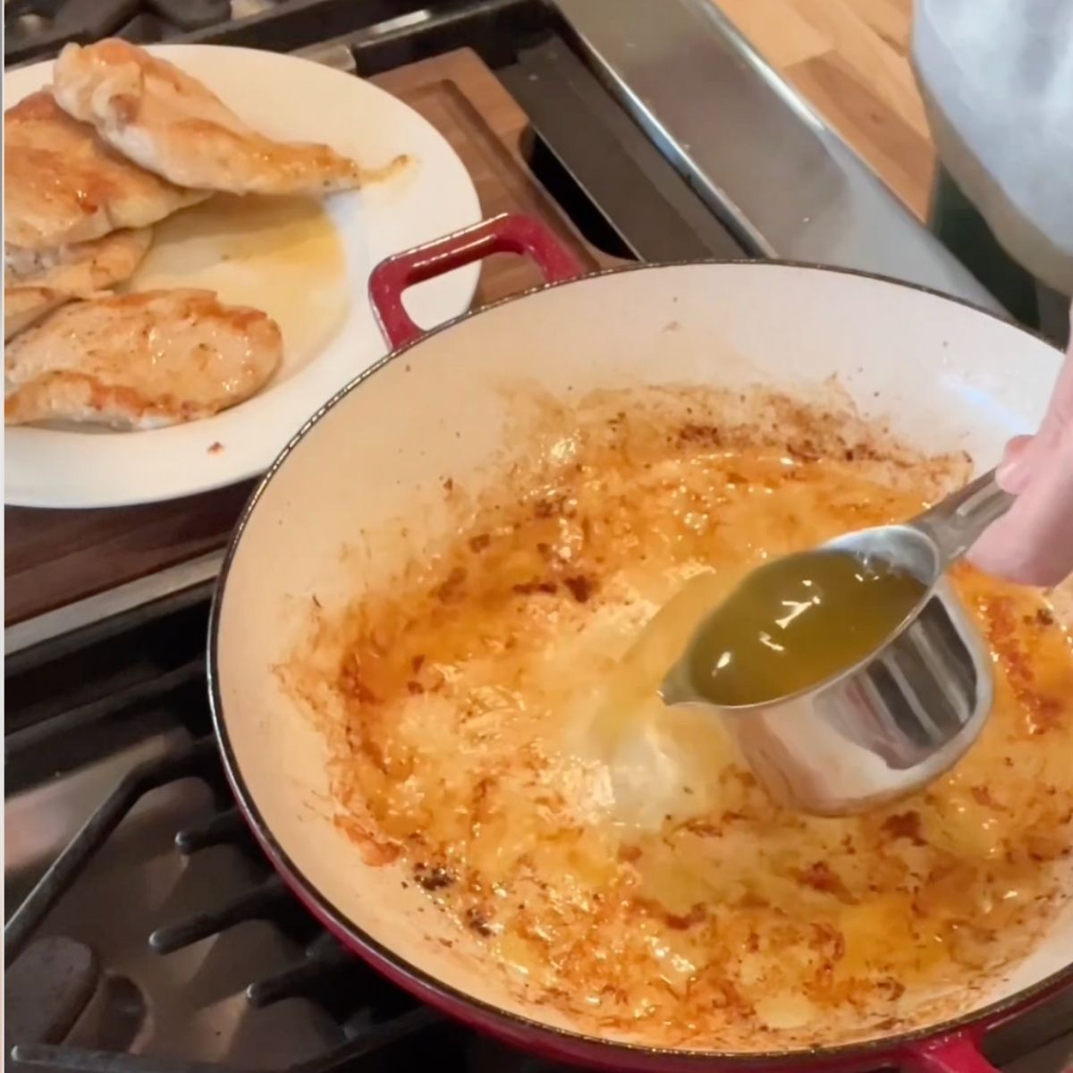A pan being deglazed from the boursin chicken sear.